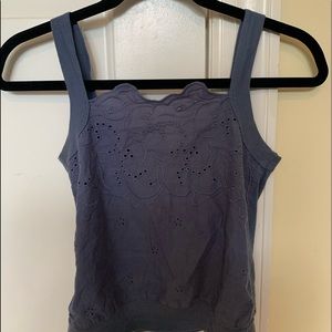 Embroidered blue tank top with latticed neckline